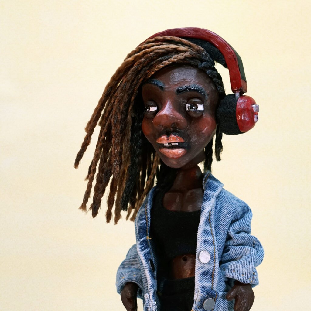 Curious Claytures | Character Focus – Serenity, a handcrafted clay sculpture with fabric and acrylic detail, themed around Empowerment